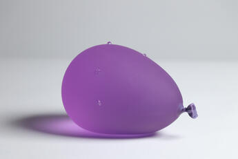 Dark Purple Water Balloon With Water Droplets by Dylan Martinez