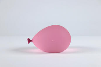 Pink Water Balloon with Water Droplets by Dylan Martinez
